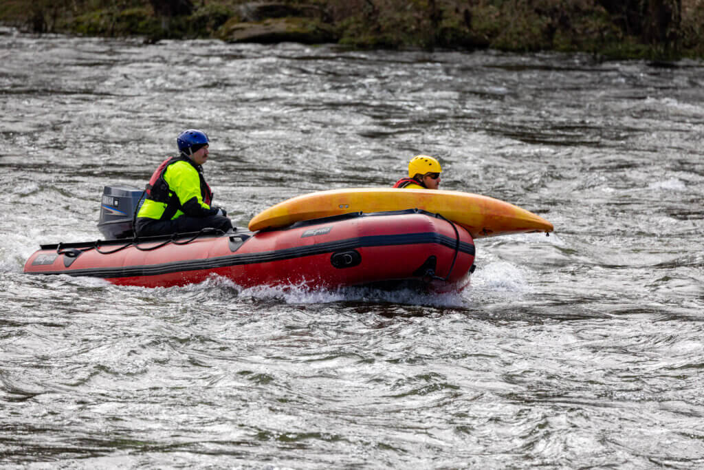 two men with Columbia Richland Fire Department on the water during excercise